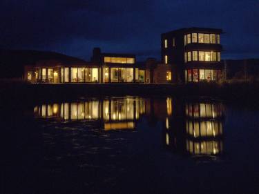 Walden House Edwards, CO - Exterior night photo of building - on lake - Selldorf Architects